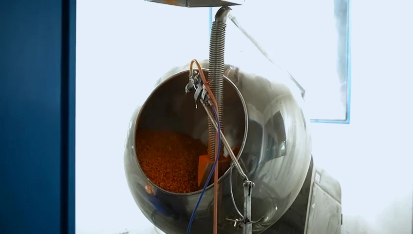 Tablets tumbling in a stainless coating pan