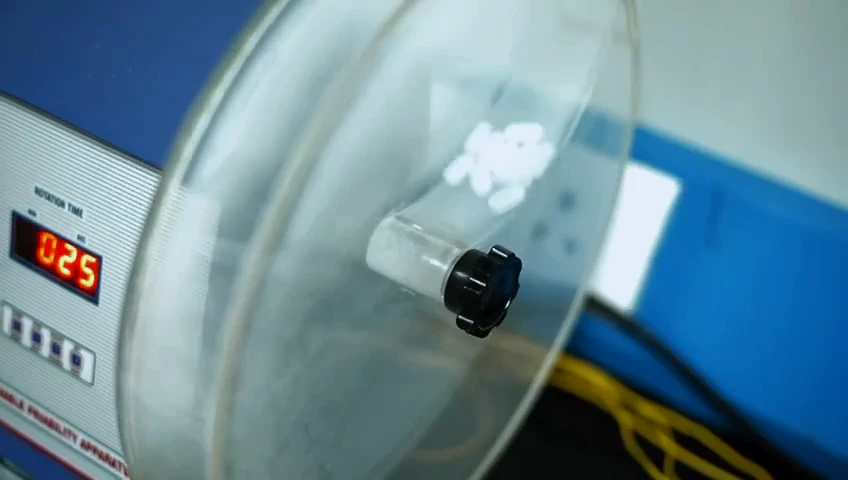 Tablets inside the drum of a friability tester